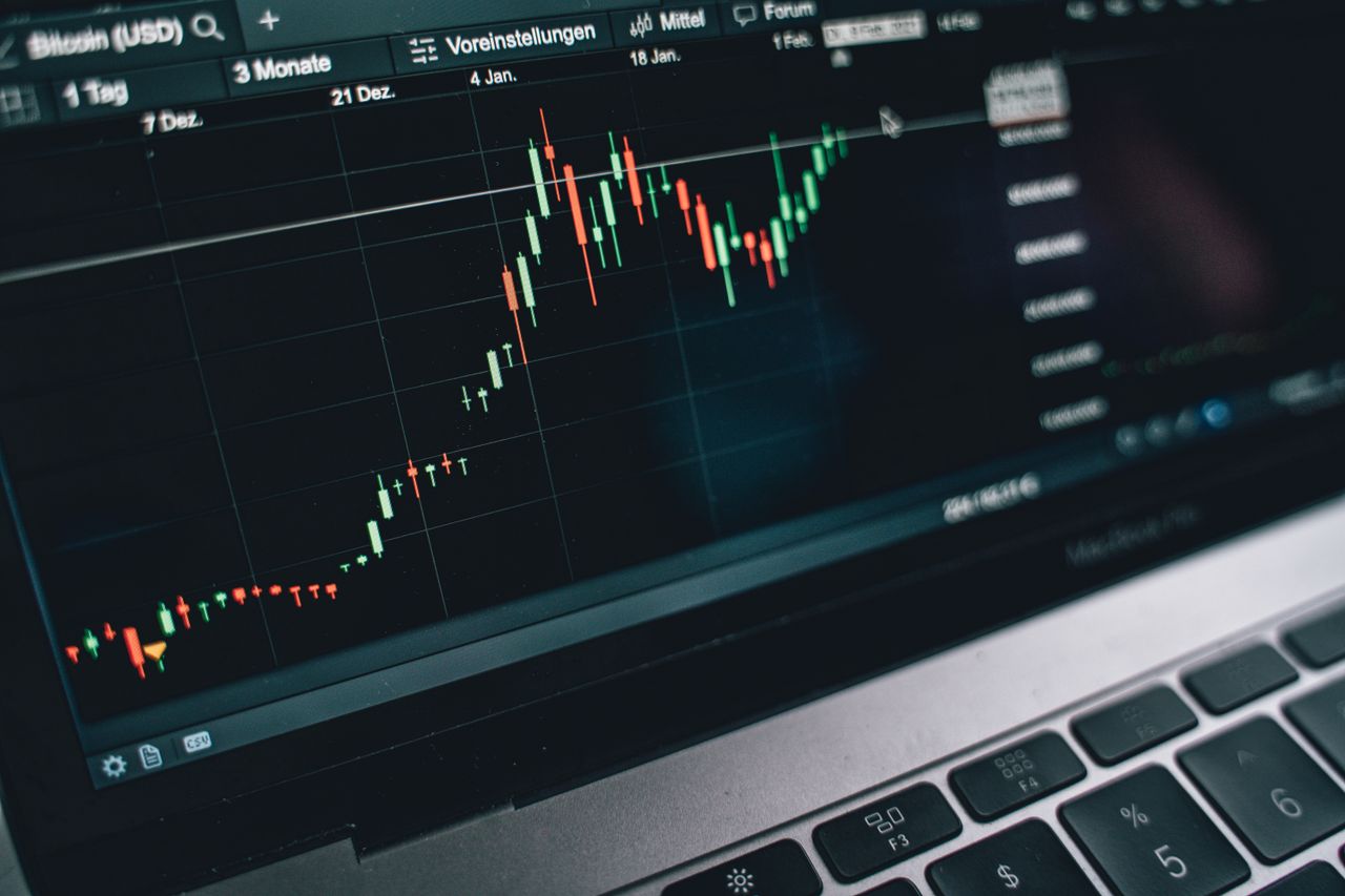 home-hero-bg Close-up of a computer screen displaying cryptocurrency market trends and data.